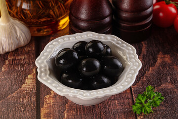 Mediterranean marinated Black olives in the bowl