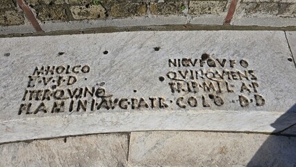 Pompeii Grand Theatre, Italy - 8 January 2025. Close-up of carved Latin inscriptions on a marble...