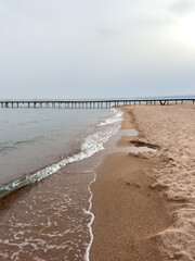 Evening calm and smooth lake surface under soft clouds