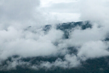 high and steep mountain surrounded by heavy clouds at chiang mai Northern Thailand