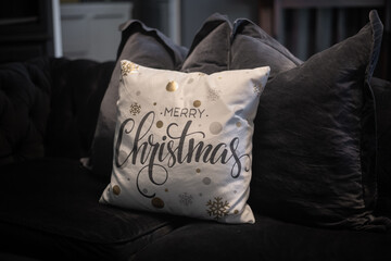 decorative cushion with Merry Christmas in a cursive font