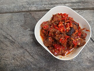 Jerado balado or Dendeng balado is a traditional cuisine from west sumatera, indonesia. it is made from slice of beef with spicy sauce called sambal