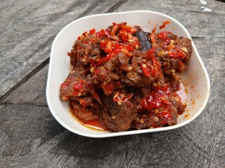 Jerado balado or Dendeng balado is a traditional cuisine from west sumatera, indonesia. it is made from slice of beef with spicy sauce called sambal