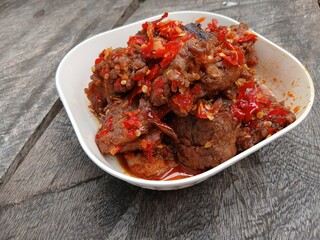 Jerado balado or Dendeng balado is a traditional cuisine from west sumatera, indonesia. it is made from slice of beef with spicy sauce called sambal