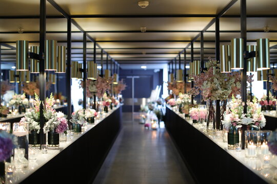 hallway with flower vases on the sides