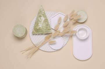Composition of plaster figures with dried flowers of lagurus. Moodboard for design