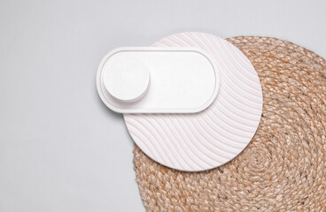 Plaster trays on a crocheted straw mat on gray background. Top view