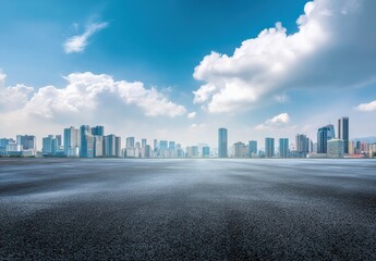 Panoramic view of empty asphalt road with city skyline background, blue sky and white clouds on a sunny day