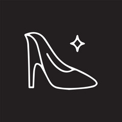 Elegant high heel silhouette sparkles against a bold black backdrop