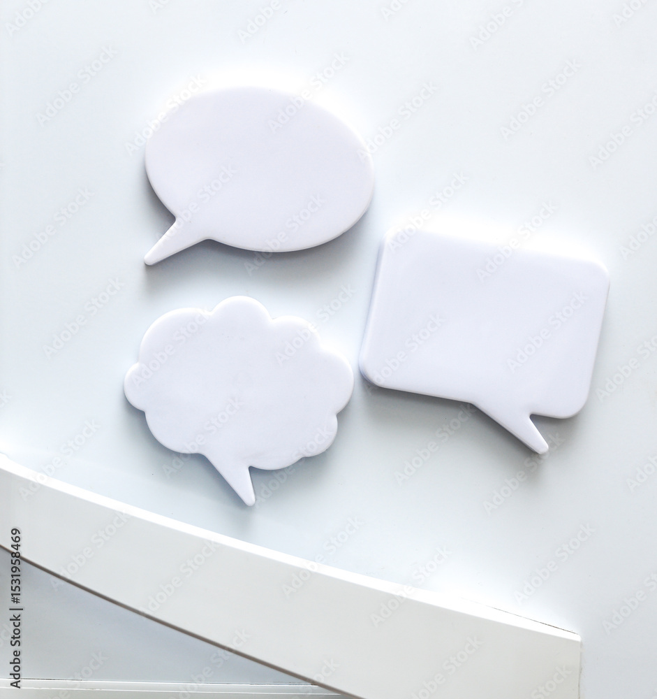 Poster white magnets in the form of a dialog clouds for notes and reminders on the refrigerator door