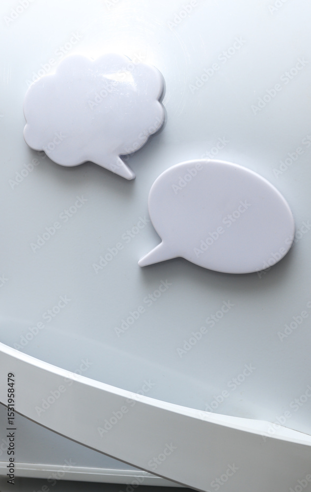 Poster white magnets in the form of a dialog clouds for notes and reminders on the refrigerator door