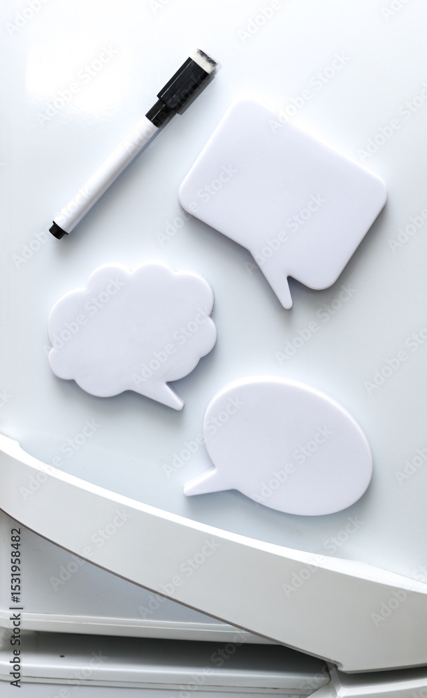 Poster white magnets in the form of a dialog clouds for notes and reminders on the refrigerator door