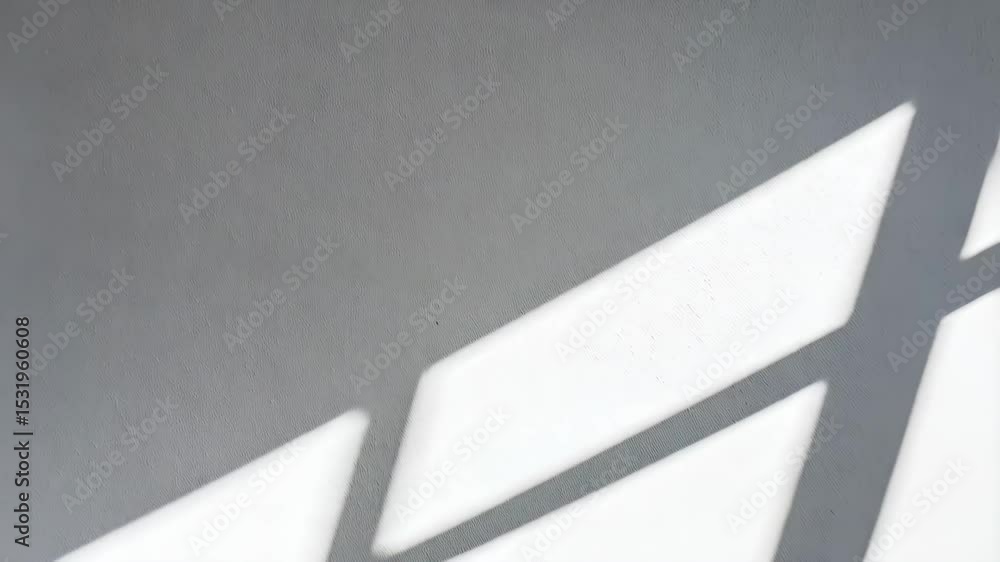Aufkleber abstract interior shot of shadows from a window casting angled lines across a textured wall.