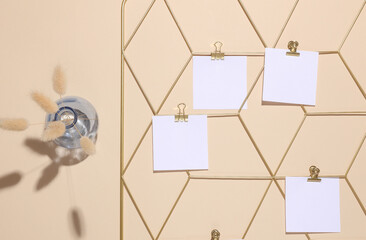 White square memo cards mockups attached to gold grid mood board on beige background