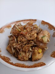 tahu telur or tahu gimbal or tahu tek or egg tofu. is a typical food of the city of Semarang. This food consists of fried tofu, chopped raw cabbage, rice cake, bean sprouts, eggs