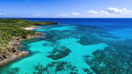 Crystal-clear turquoise waters and lush coastal landscape under a bright blue sky.