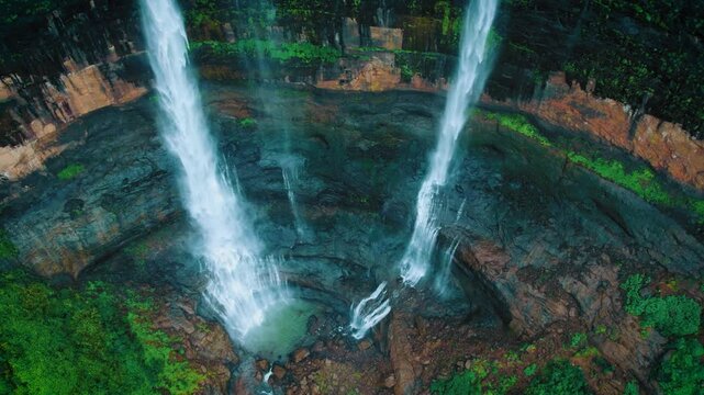 4K Drone shot of Beautiful Kataldhaar waterfall falling from cliff near Lonavala, Maharashtra, India. Monsoon waterfall in Sahyadri hills. Nature landscape. Travel background.