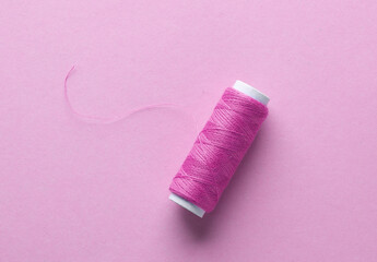 Skein of pink threads on a pink background