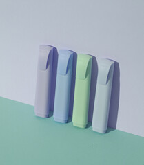 Markers on pastel background with shadow. Business, education concept. Creative layout, minimalism