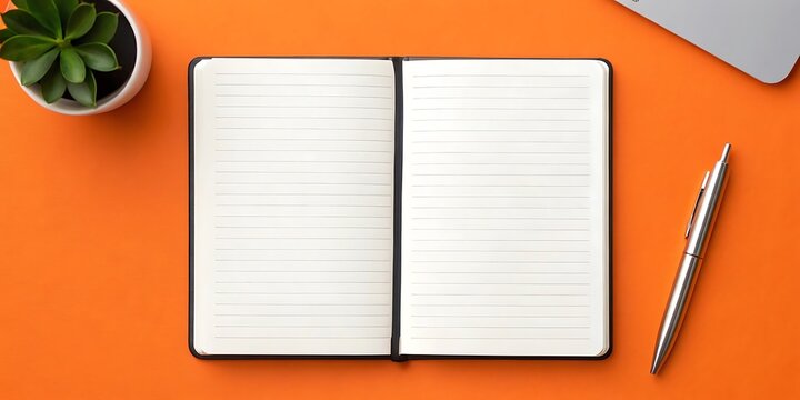 Open lined notebook on vibrant orange surface, ready for notes.