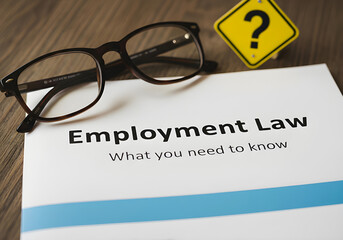 A close-up image of a document titled "Employment Law" with a light-gray banner indicating "What you need to know" and a yellow caution triangle with a question mark.