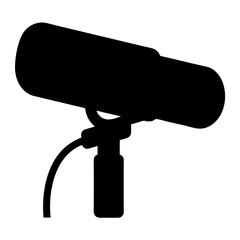 Silhouette of a boom microphone on a stand with audio cable