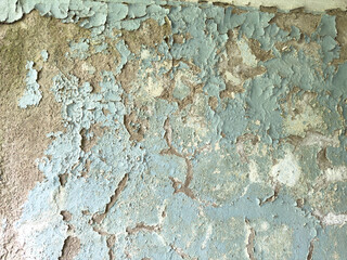 Old plaster with cracks and peeling paint. texture of old wall