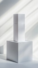 Two white geometric shapes stacked on a light background. The scene features soft shadows and a minimalist design, emphasizing simplicity and modernity.