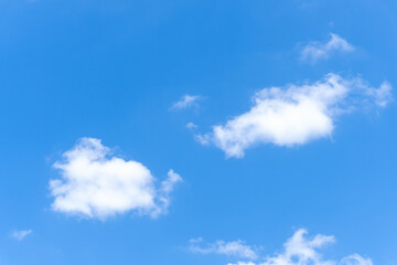 Low angle view and full frame of beautiful blue sky with strange shape of white fluffy of clouds in the morning or afternoon  on sunny day used as natural background texture in decorative art work