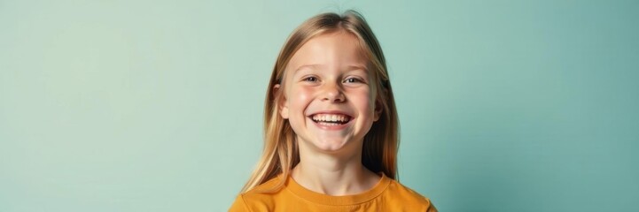 Joyful youthful subject, beaming smile, clean backdrop, portrait, headshot