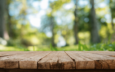 A empty wooden board with a beautiful blurred background of green bokeh nature, for showcasing your...