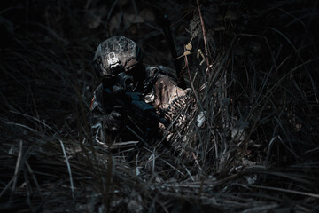 Army sniper during the military operation, dark process
