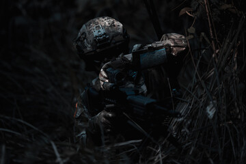 Army sniper during the military operation, dark process
