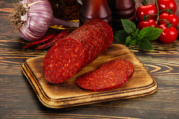 Spicy pepperoni sausages with sliced piece