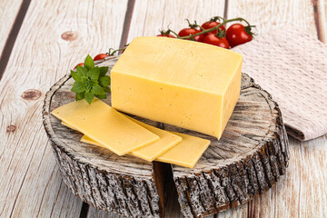 Yellow cheese piece with slices