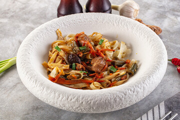 Asian cuisine udon with chicken and vegetables