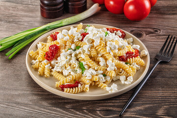 Italian pasta fusili with curd
