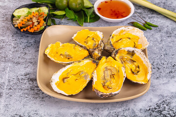 Baked oyster with cheddar cheese