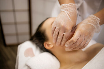 Buccal Massage Therapy in Beauty Spa – Woman Receiving Intraoral Facial Treatment by Professional with Gloves