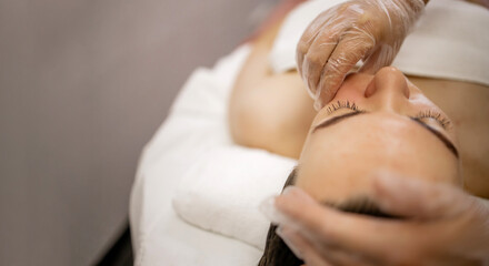 Buccal Massage Therapy in Beauty Spa – Woman Receiving Intraoral Facial Treatment by Professional with Gloves