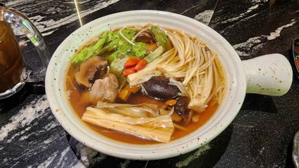 Delicious Herbal Soup with Fresh Vegetables and Tender Meat
