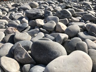 Sea stones background. Colorful small pebbles or stone in garden. Flat lay of sea stones texture background. Abstract shape pattern from nature. High quality photo