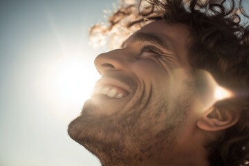 Joyful caucasian male young adult enjoying sunlight smiling.