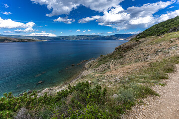 A walk along the rocky road from the beach in Baska to the top of Mount Bag,