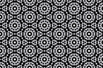 Delicate white blossoms emerge from bold black grainy textures