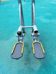 Outdoor training park with leg strengthening, stepping machine, on a blue rector's podium.