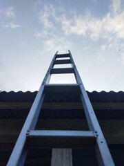 A ladder to the roof of the house.