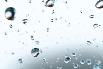 Sparkling Cascade: A close-up captures the dynamic beauty of water droplets in a mesmerizing display of transparency and fluidity. Capturing purity and freshness.