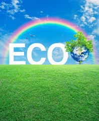 Obraz premium ECO acronym with earth and tree on green grass field over rainbow, birds and blue sky, Ecology saving power and energy concept, Save the earth concept, Elements of this image furnished by NASA