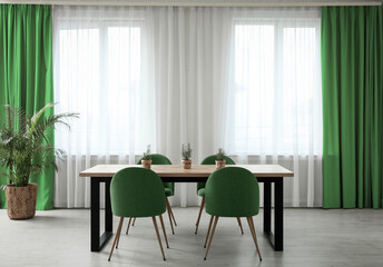 Dining room interior with green color accent
